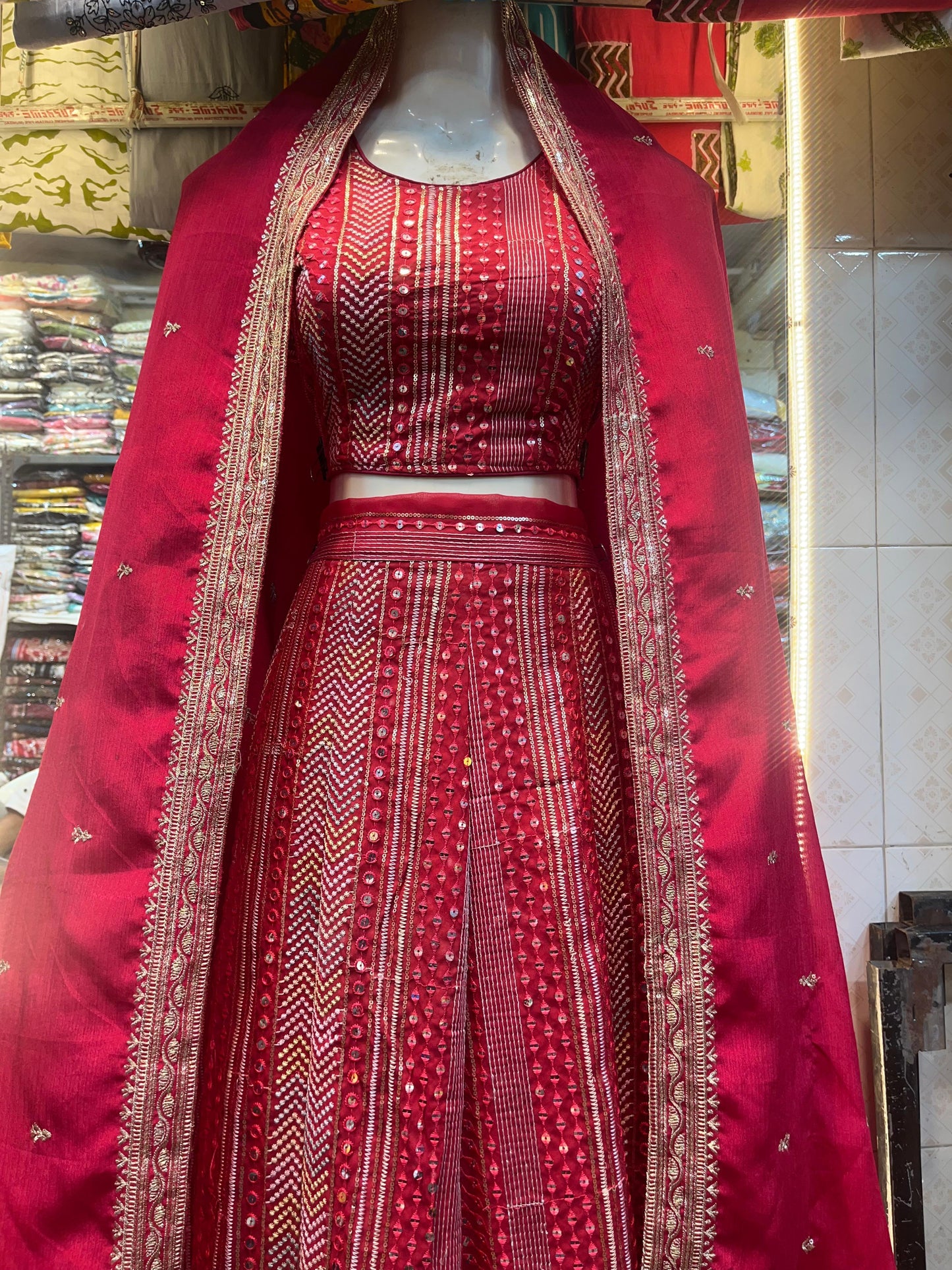 Royal Crimson Mirror Work Lehenga.